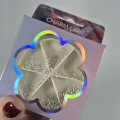 Caviar blanco perlado charm limit